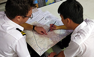 Student and instructor viewing a flight map